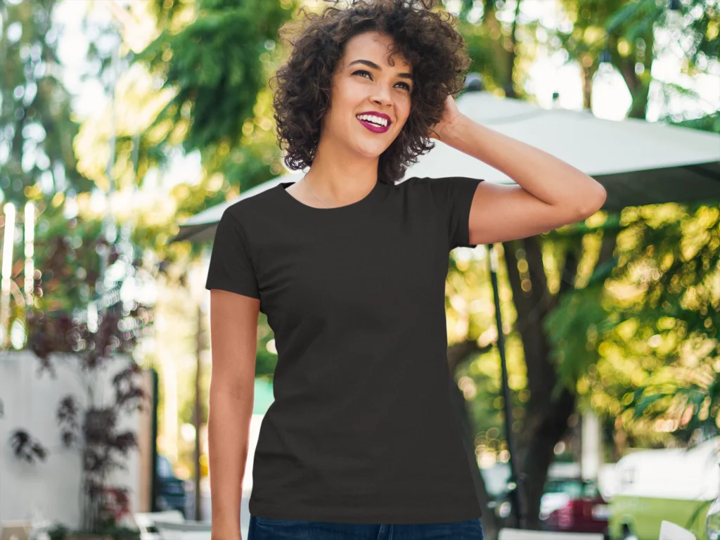 a women in black tshirt at outside cafe